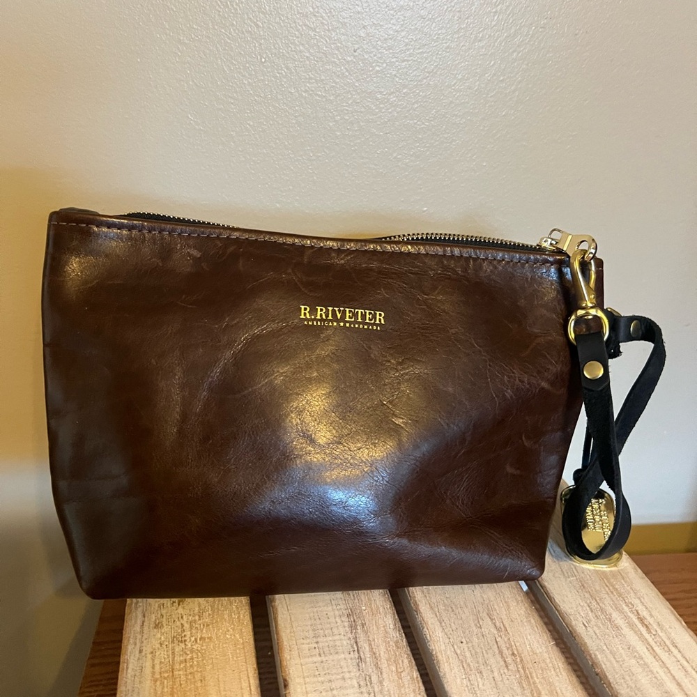 R.Riveter brown leathered clutch with strap and military tag harm